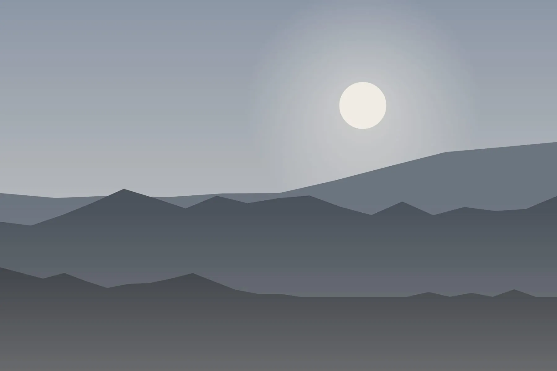 Layers of hills under a low grey sky