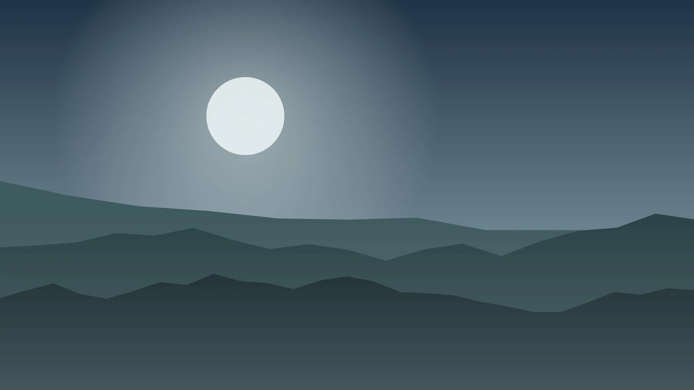 A dark loch beneath blue mountains