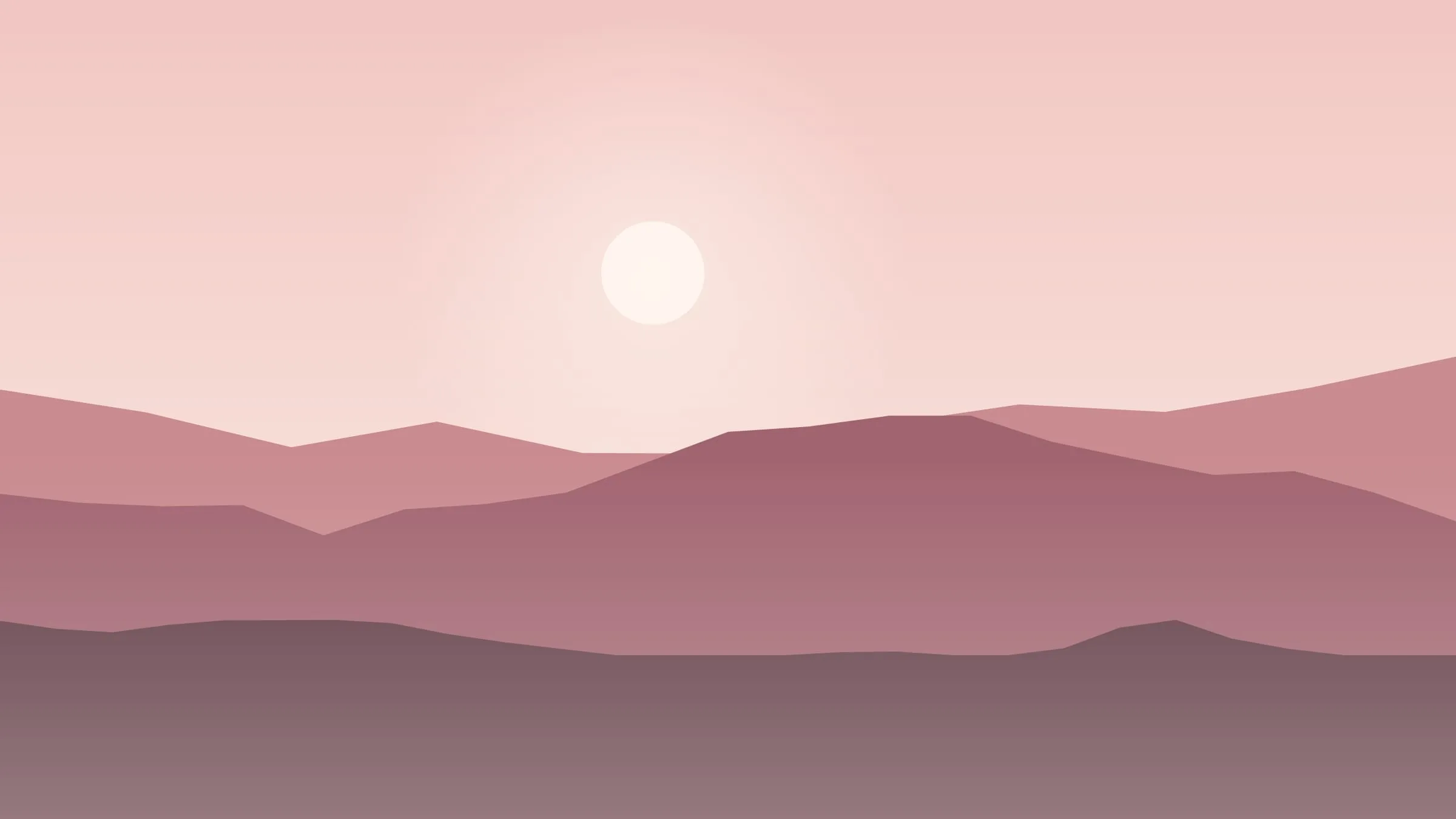Pink hills beneath a pale spring sky